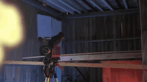 a camera on a tripod that says ' fujinon ' on the front