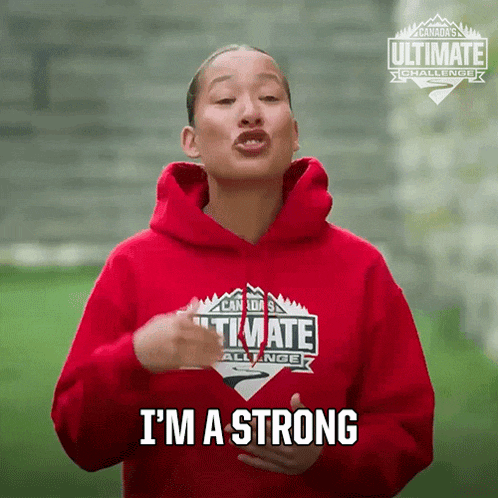 a woman wearing a red hoodie with the words i 'm a strong on it