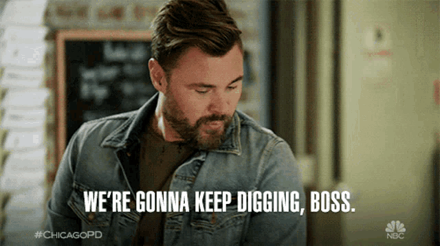 a man with a beard and a denim jacket says we 're gonna keep digging boss