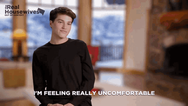 a man says i 'm feeling really uncomfortable in front of a real housewives poster