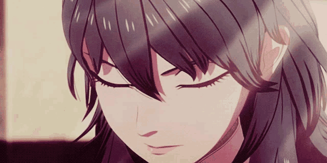 a close up of a girl 's face with closed eyes