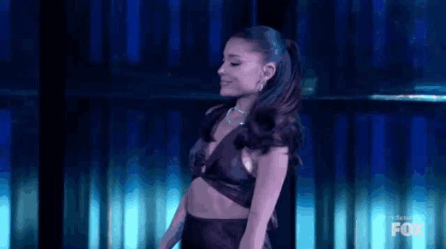 a woman is dancing on a stage in front of a fox logo