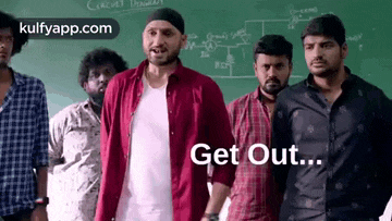 a group of men are standing next to each other in front of a chalkboard .