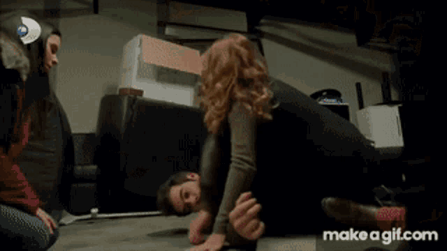 a close up of a woman 's face with the words make a gif.com in the corner