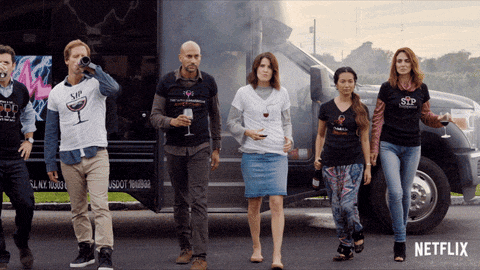 a group of people are standing in front of a netflix truck