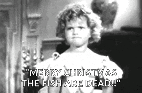 a little girl says merry christmas the fish are dead in a black and white photo