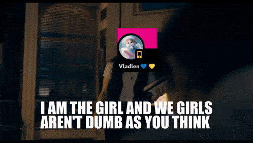 a woman holds a piece of paper in front of her face with vladlen on it