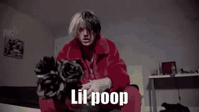 a man in a red fur coat is sitting on a bed with a dog and says `` lil poop '' .
