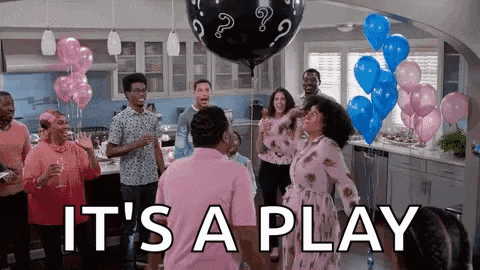 a group of people are dancing at a gender reveal party with balloons and champagne .