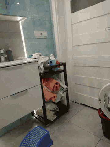 a laundry room with a washing machine and a basket