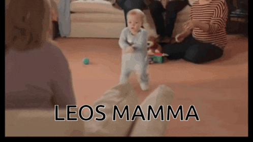 a baby is walking in a living room with the words leos mamma written on the bottom