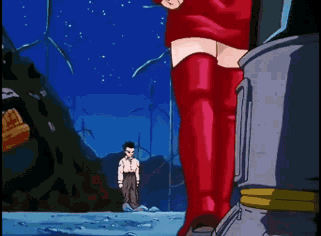 a woman in a red dress stands next to a man