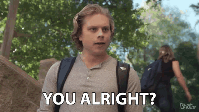 a man with a backpack is asking if he is alright