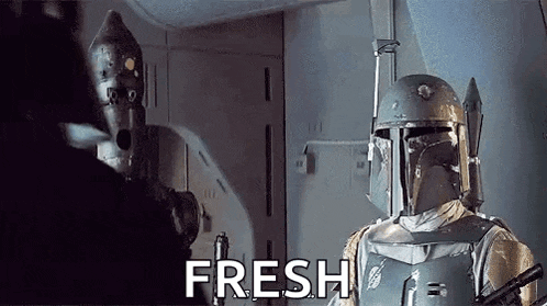 boba fett is wearing a helmet and holding a gun while talking to a robot .