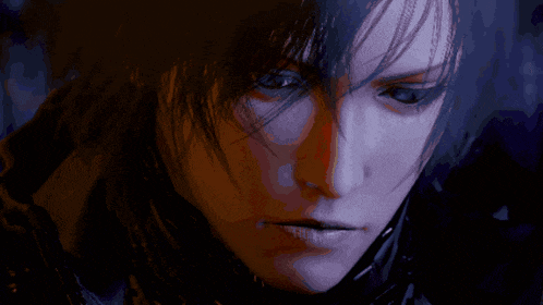 a close up of a person 's face with a dark hair style