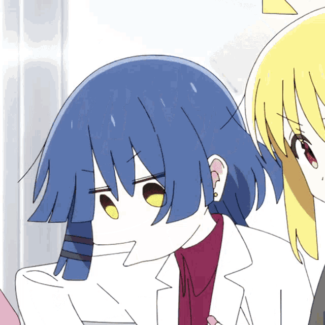 a girl with blue hair is holding a spoon in her mouth while another girl looks on