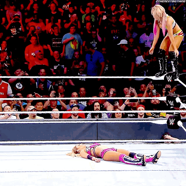 a woman in a wrestling ring with the next thing written on the bottom left