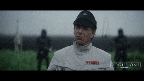 a poster for rogue one star wars shows a man in a white jacket