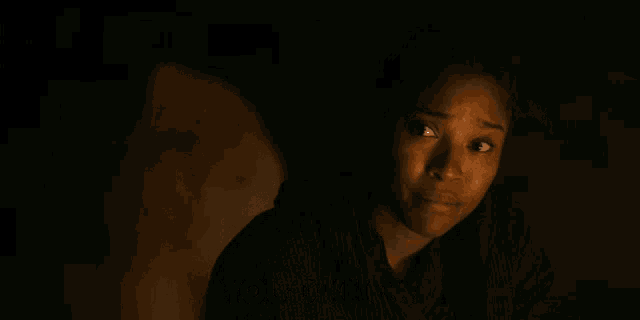 a woman says " if you cared enough to ask " in a dark room