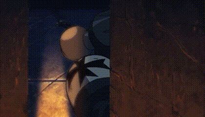 a close up of a mickey mouse balloon with a star on it in a dark room .