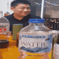 a bottle of north brooks spring water is on a table