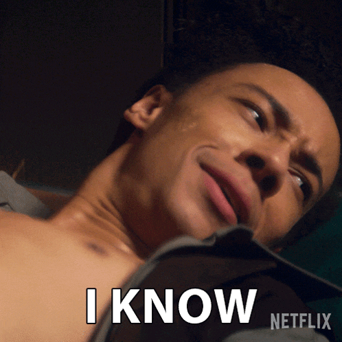 a man laying on a bed with the words i know netflix on his chest