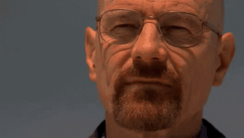 a man with glasses and a beard has the words you 're god damn right above his face