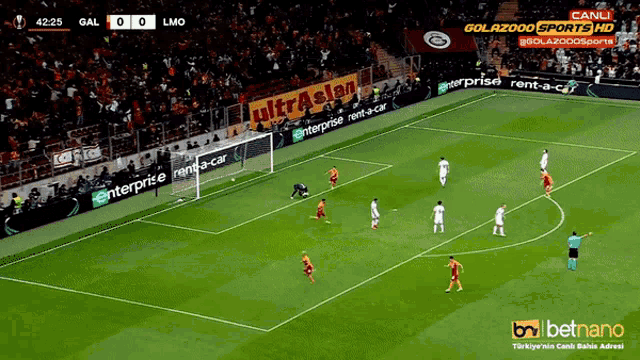 a soccer game is being played in a stadium sponsored by enterprise rent-a-car and betnano