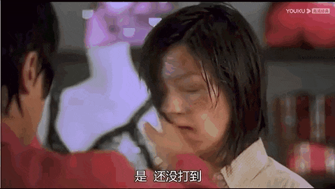 a man is putting his hand on a woman 's face in a scene from a movie .