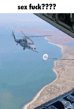 a helicopter is flying over a body of water with the words sex fuck written above it