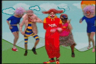 a group of clowns are dancing on a hillside