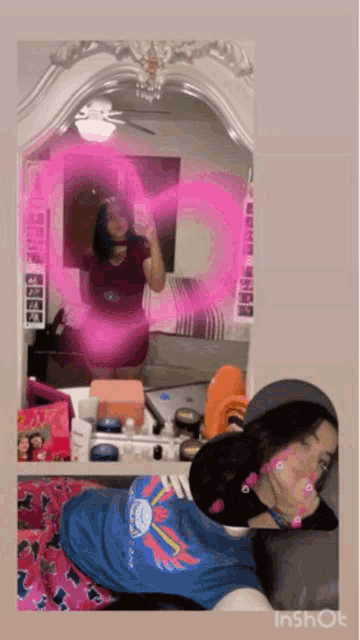 a girl taking a picture of herself in a mirror