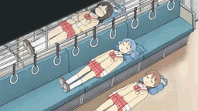 three girls are laying on a blue couch with their legs crossed
