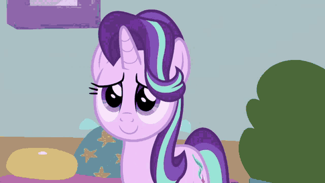 a cartoon pony with a purple mane and blue stripes looks sad