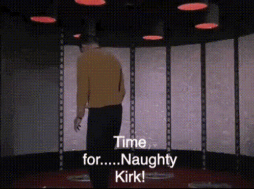 a man in a yellow sweater is standing in a room and says " time for naughty kirk "