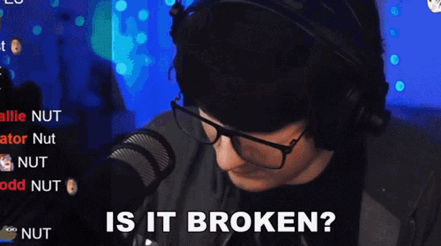 a man wearing glasses and headphones is asking if it is broken