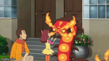 a man and a girl are standing in front of a house looking at a red monster with fire coming out of its mouth .