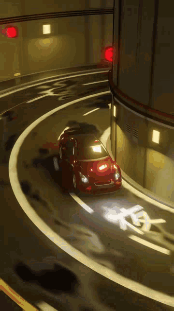 a red car is driving through a tunnel with a handicap sign