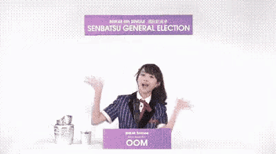 a woman stands in front of a podium that says senbatsu general election