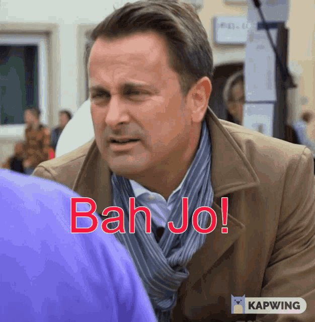 a man in a brown coat says bah jo on the screen