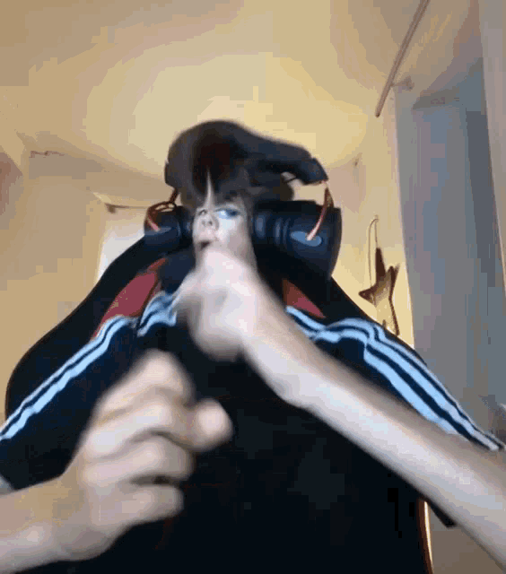 a person wearing headphones is making a face