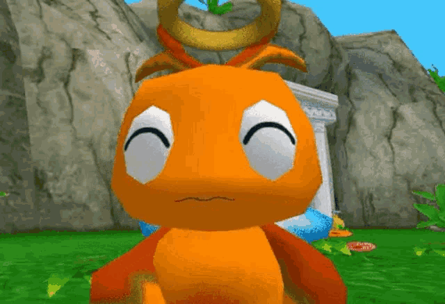 a close up of an orange cartoon character with a crown on his head .