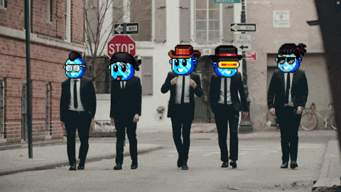 a group of men in suits are walking down a street with a stop sign in the background