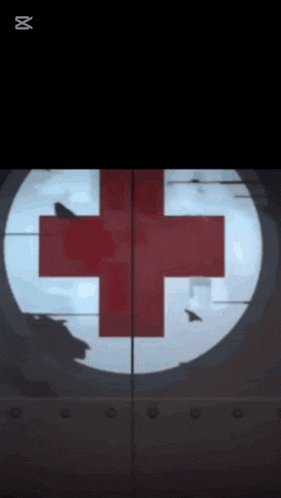 a sniper scope with a red cross on it
