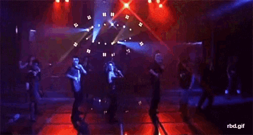 a group of people are dancing on a stage with a watermark that says rbd.gif at the bottom