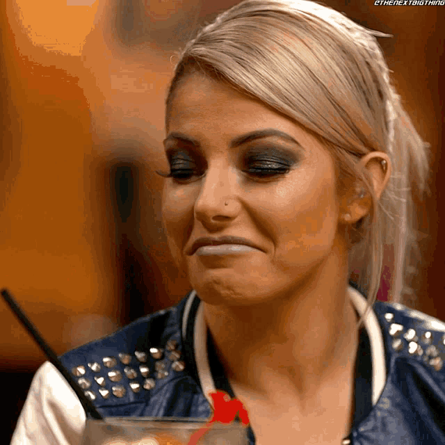 a close up of a woman making a funny face
