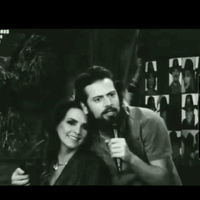 a black and white photo of a man and woman