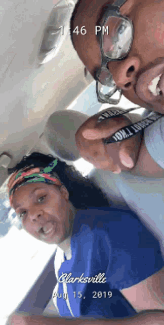 a man and a woman are sitting in a car in clarksville on august 15th 2019