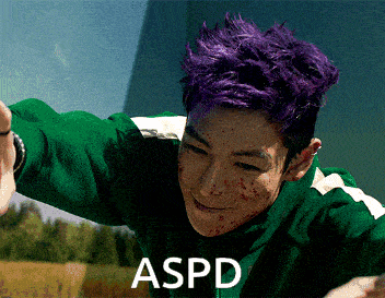 a man with purple hair is wearing a green jacket and the word aspd is on the bottom