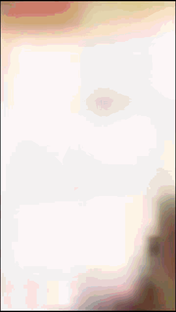 a blurred image of a person 's face against a white background